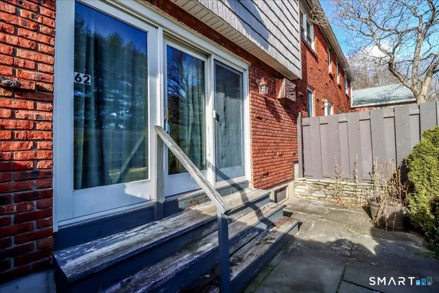 a backyard of a house with seating space and deck