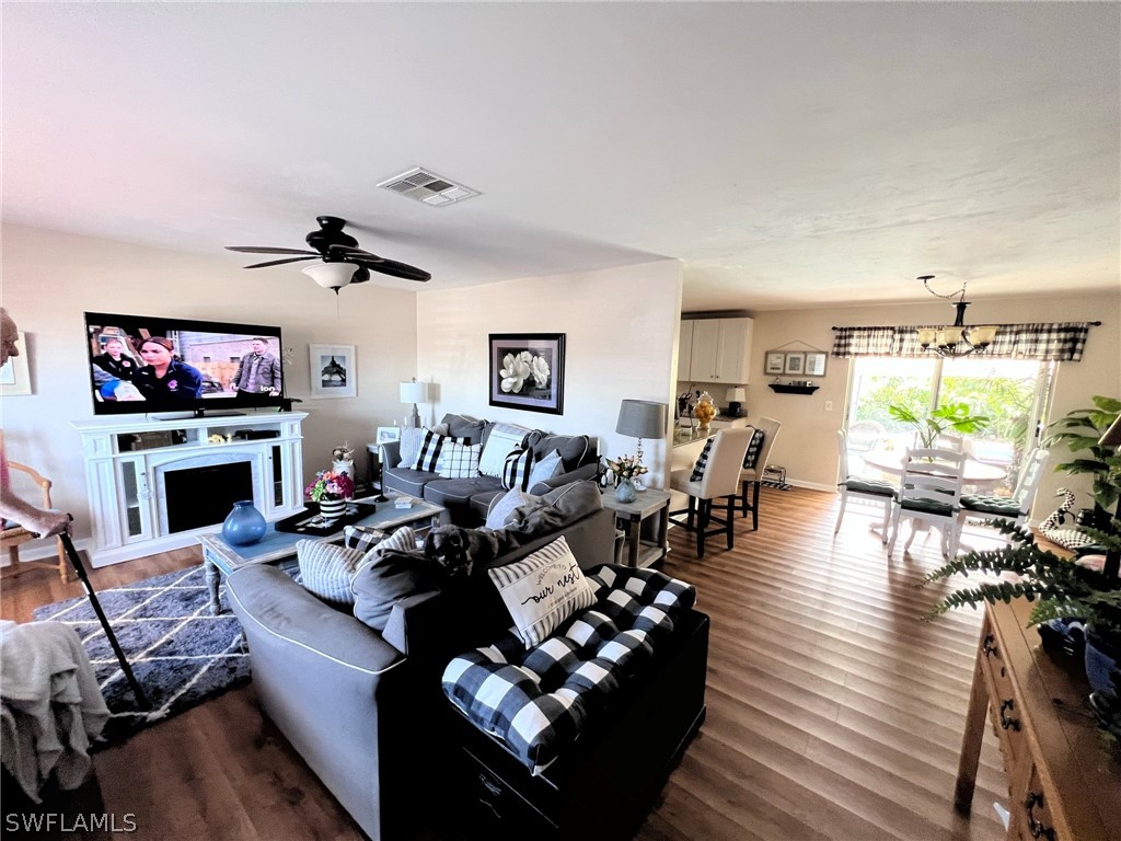 7262 Jonas Road Fort Myers, FL 33967 - Photo 3 of 22 a living room with furniture large window and a fireplace