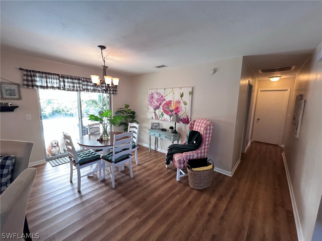 7262 Jonas Road Fort Myers, FL 33967 - Photo 9 of 22 a living room with furniture and a wooden floor