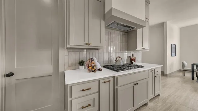 a dining room with furniture a chandelier and wooden floor