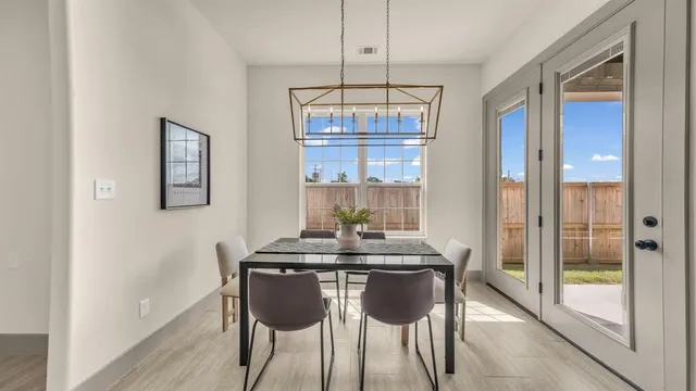 a large kitchen with kitchen island a large counter space a sink stainless steel appliances and cabinets
