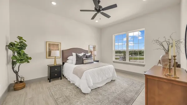 a bedroom with a bed and a couch