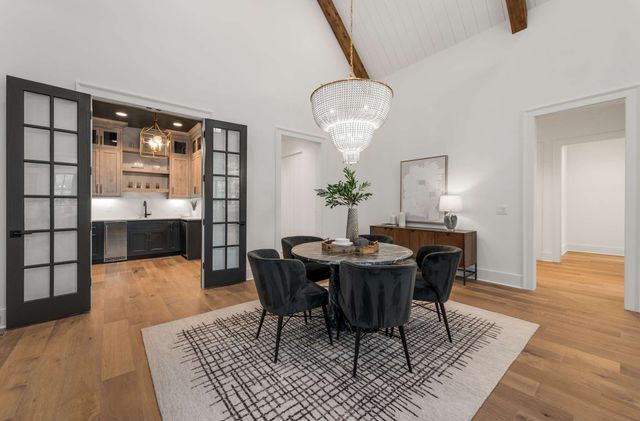 a stove top oven sitting inside of a kitchen