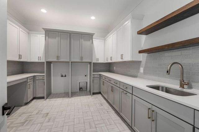 a view of hallway with a large window and wooden floor