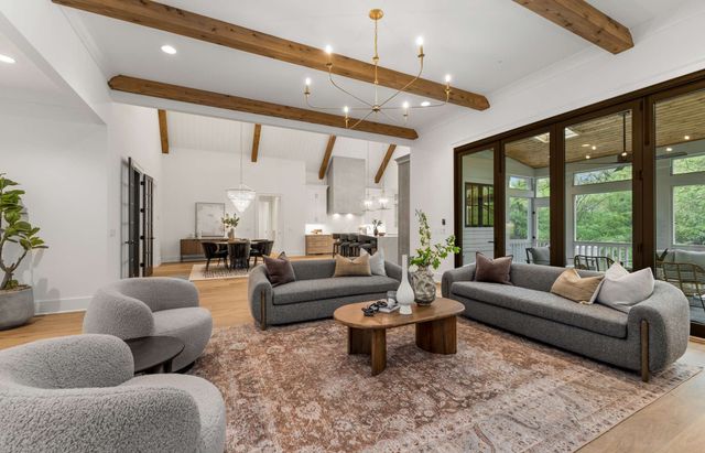 a living room with furniture fireplace and flat screen tv