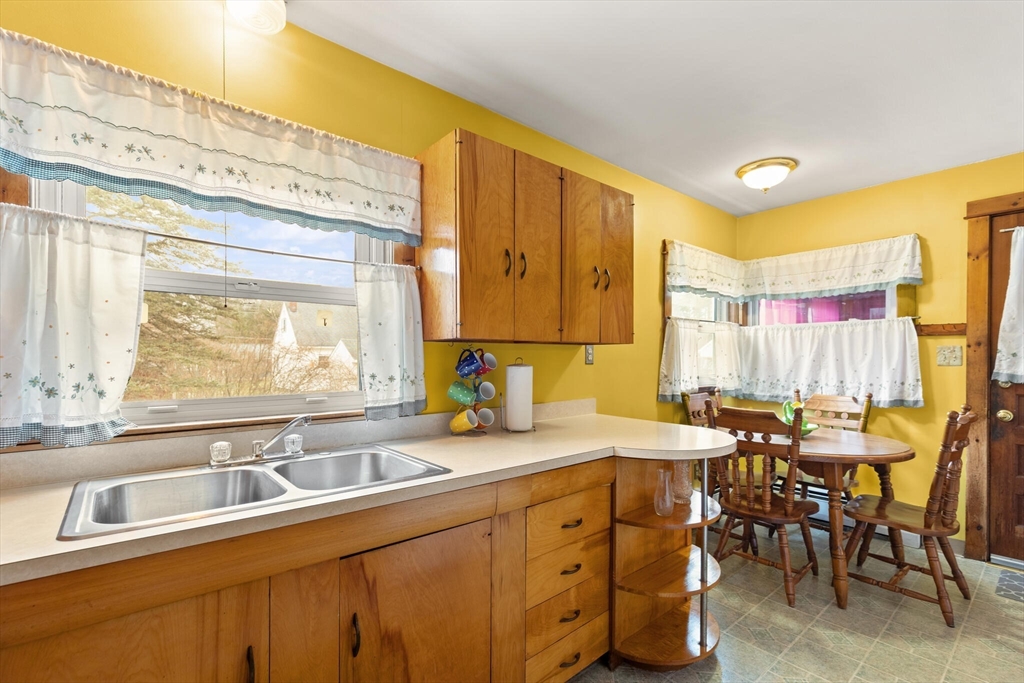 4 Vernon Street Ayer, MA 01432 - Photo 2 of 23 a kitchen with a sink cabinets and window