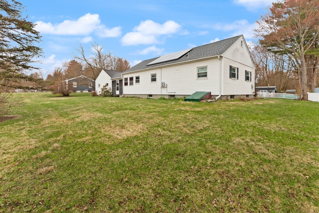 4 Vernon Street Ayer, MA 01432 - Photo 21 of 23 a view of a white house with a big yard and large trees