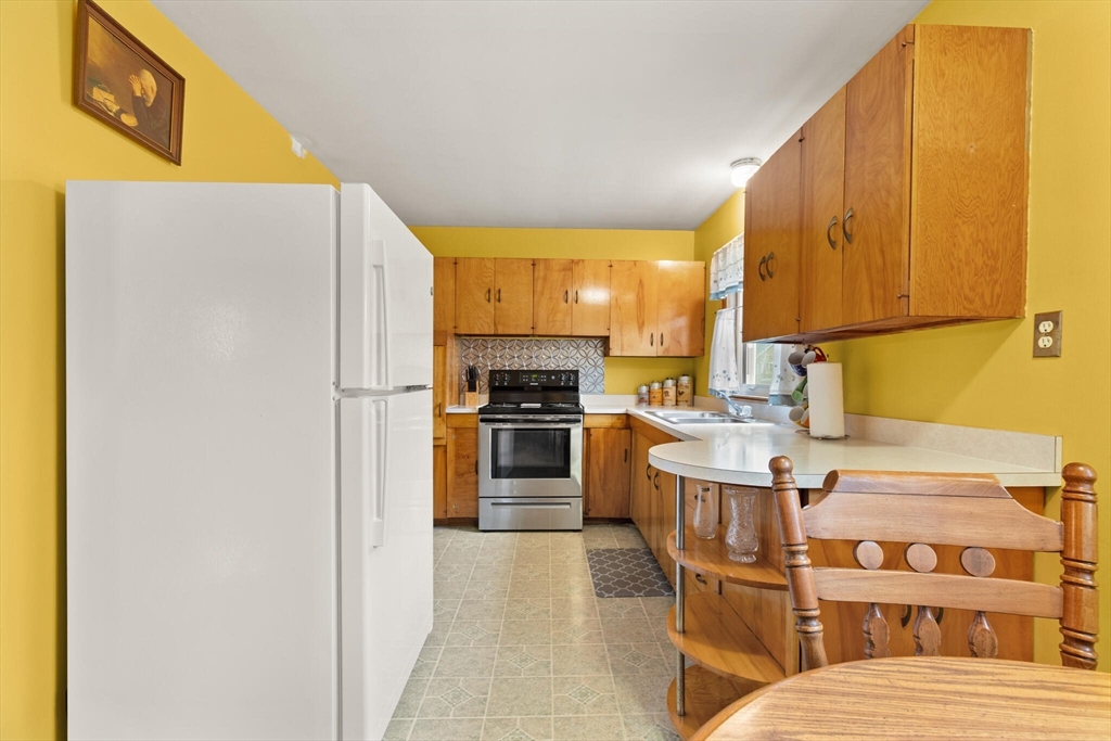 4 Vernon Street Ayer, MA 01432 - Photo 4 of 23 a kitchen with a sink appliances and cabinets