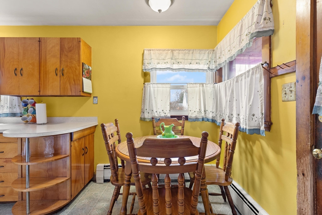 4 Vernon Street Ayer, MA 01432 - Photo 5 of 23 a view of a dining room with furniture and wooden floor