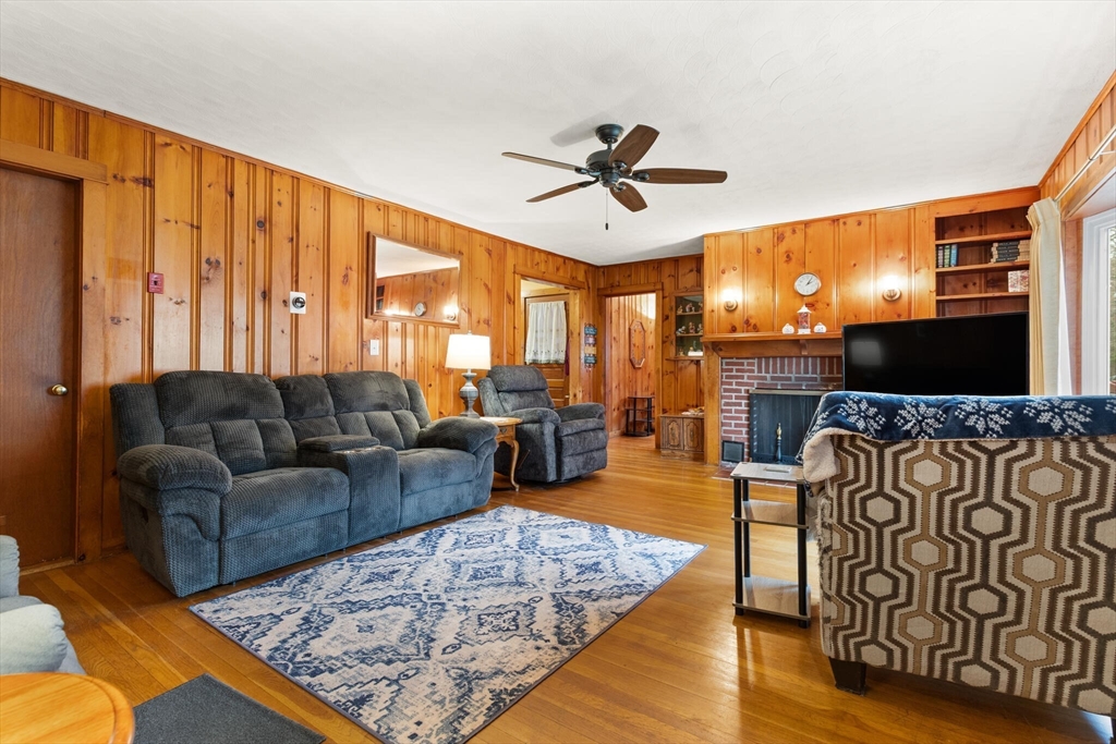 4 Vernon Street Ayer, MA 01432 - Photo 6 of 23 a living room with fireplace furniture and a flat screen tv