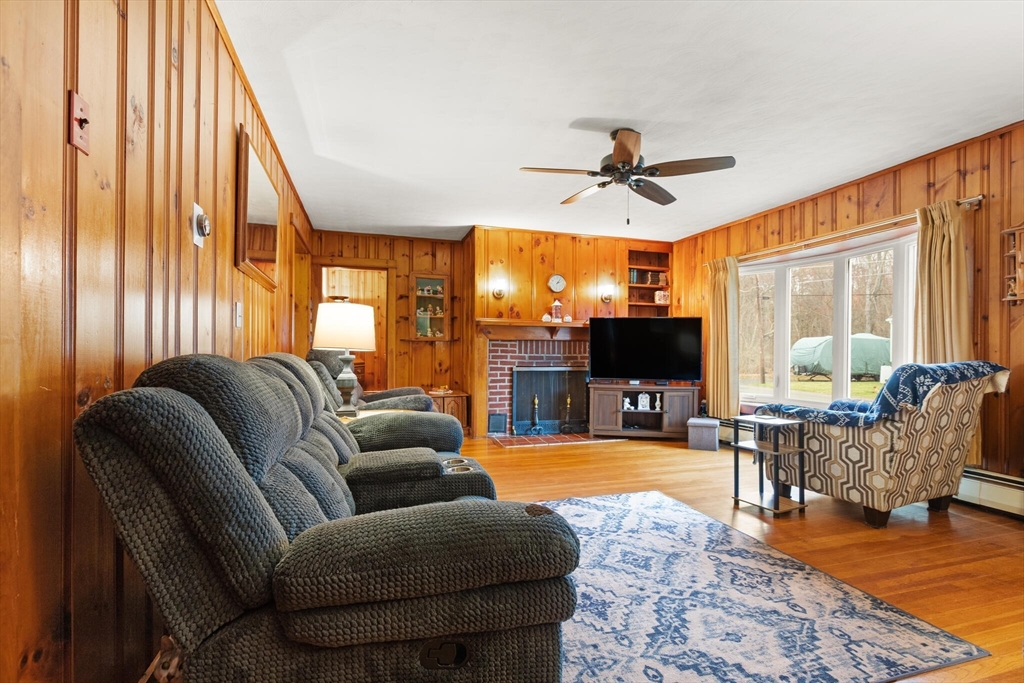 4 Vernon Street Ayer, MA 01432 - Photo 7 of 23 a living room with furniture and a flat screen tv