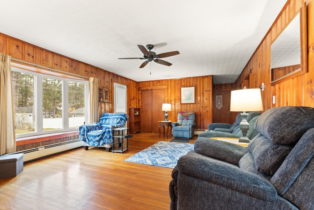 4 Vernon Street Ayer, MA 01432 - Photo 9 of 23 a living room with furniture and a large window with outer view