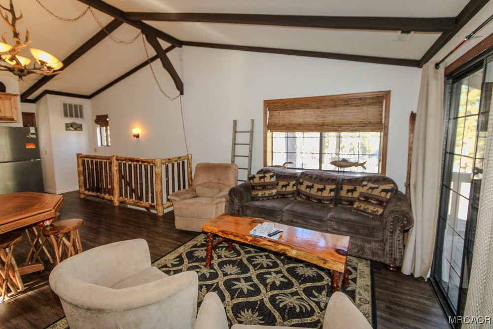 664 Knight Avenue Big Bear Lake, CA 92315 - Photo 11 of 35 a bedroom with a bed and wooden floor