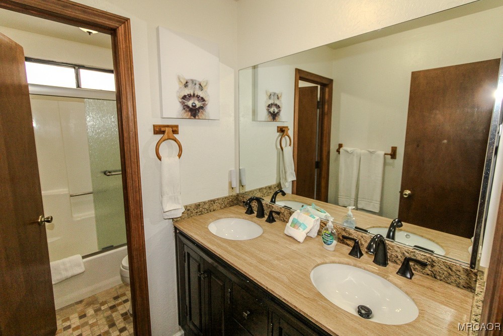 664 Knight Avenue Big Bear Lake, CA 92315 - Photo 24 of 35 a bathroom with a sink double vanity and a mirror
