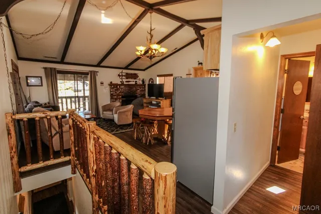 a view of a hallway with stairs