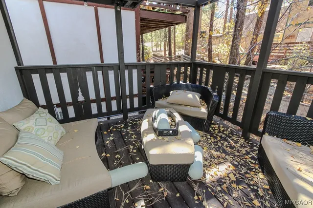 a view of balcony with wooden floor