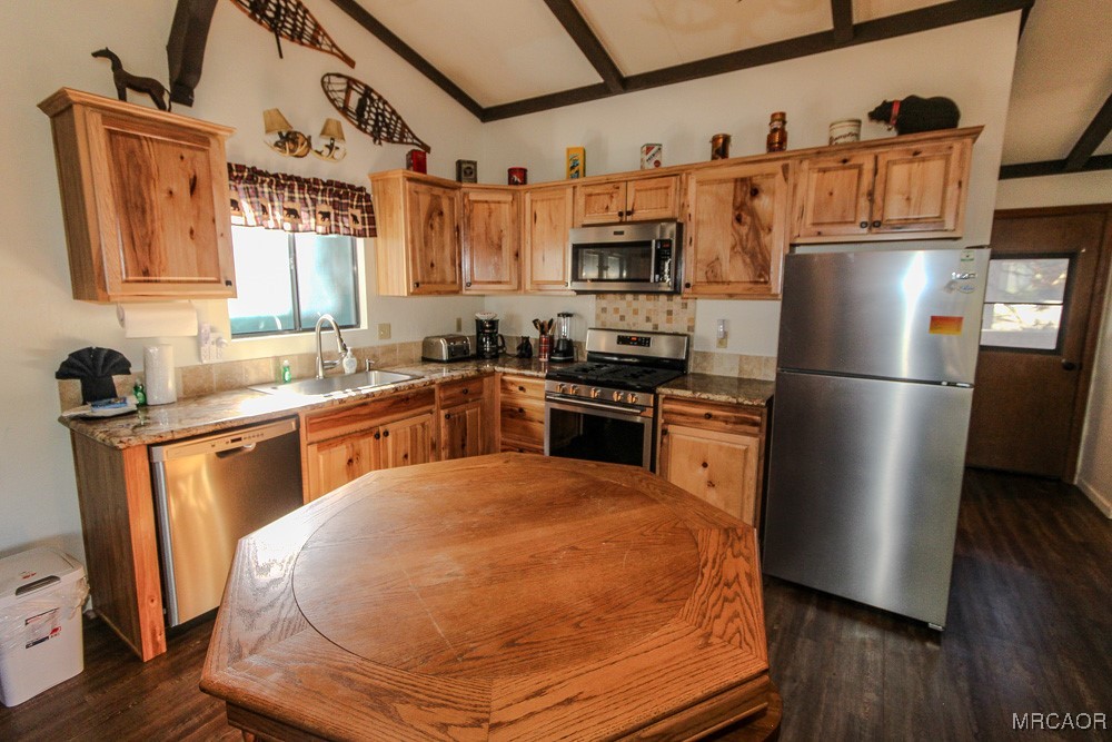 664 Knight Avenue Big Bear Lake, CA 92315 - Photo 7 of 35 a kitchen with stainless steel appliances granite countertop a refrigerator a sink dishwasher a stove with wooden floor