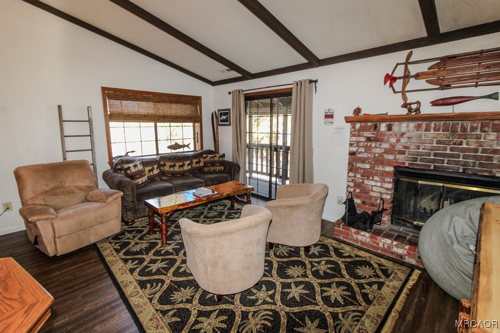 664 Knight Avenue Big Bear Lake, CA 92315 - Photo 10 of 35 a living room with furniture and a fireplace