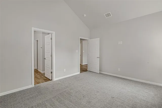 an empty room with closet area