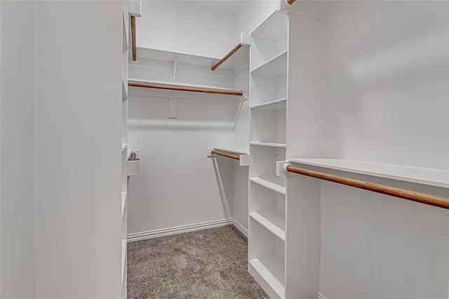 a view of an empty walk in closet
