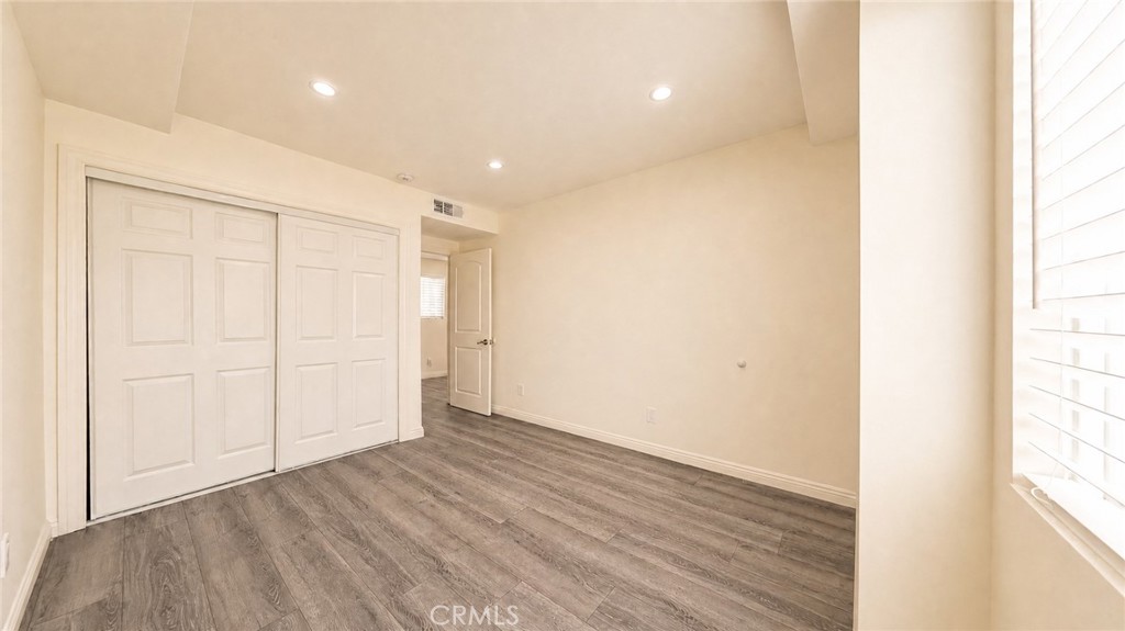 6851 Foothill Boulevard Tujunga, CA 91042 - Photo 40 of 50 a view of an empty room with wooden floor