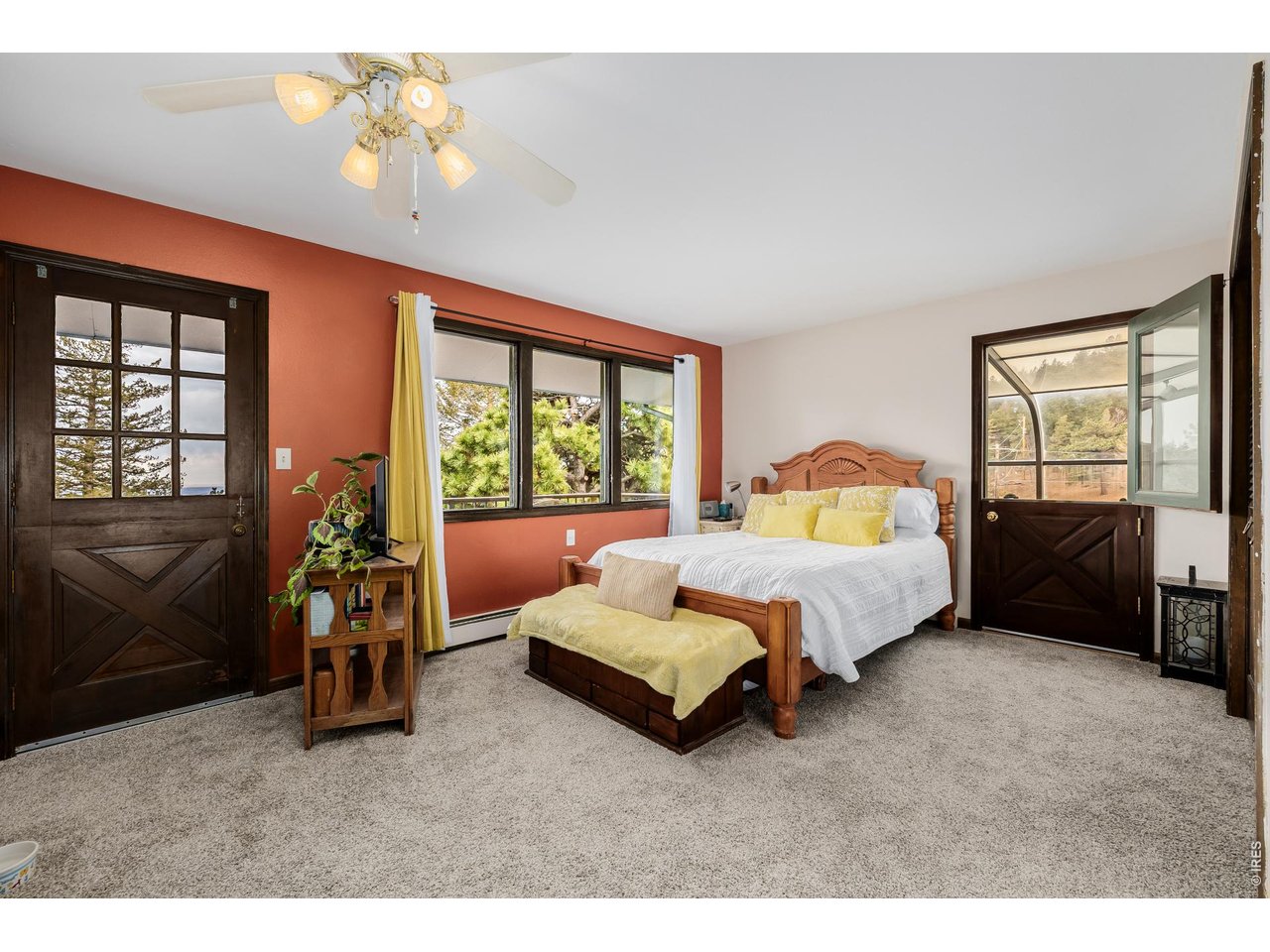 37 High View Lane Boulder, CO 80302 - Photo 18 of 50 a spacious bedroom with a bed and a chandelier
