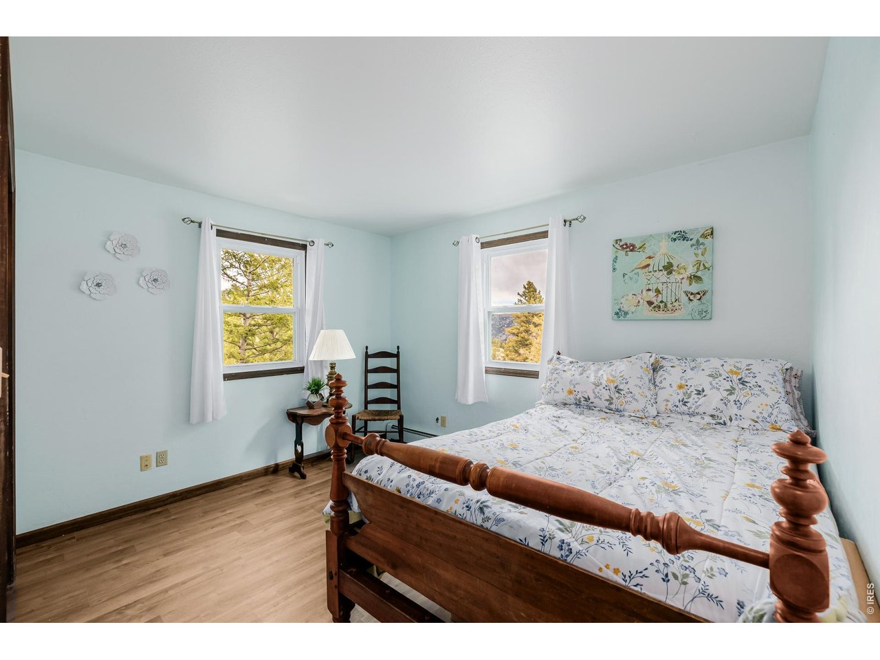 37 High View Lane Boulder, CO 80302 - Photo 26 of 50 a bedroom with a bed and wooden floor