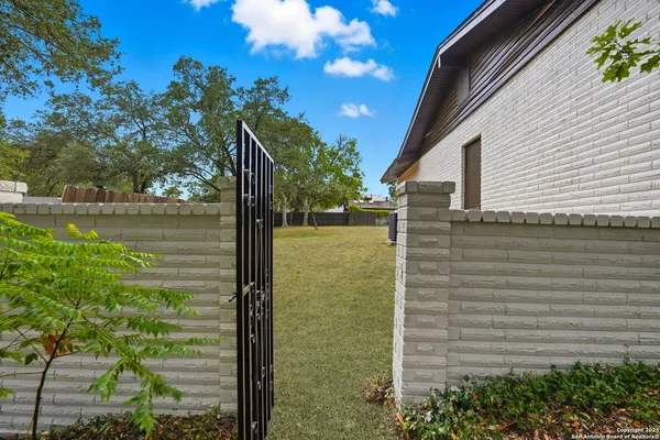 a view of a backyard of the house