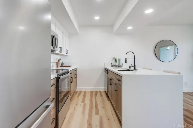 a view of hallway with wooden floor
