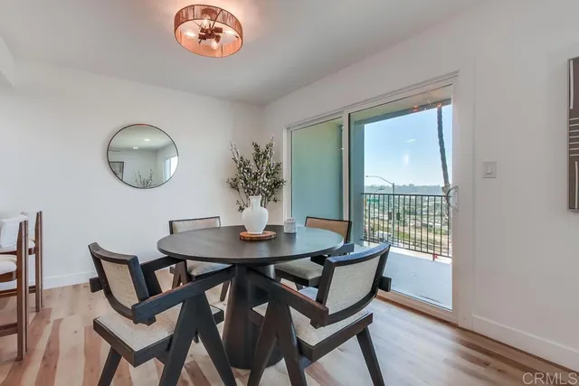 a view of a dining room with furniture and a chandelier