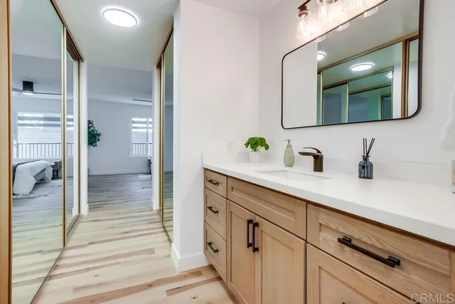 a bathroom with a double vanity sink and mirror