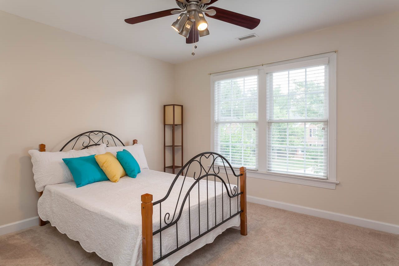 8412 Aptos Court Raleigh, NC 27613 - Photo 22 of 25 This bedroom is located at the font on the home on the second floor Bedroom