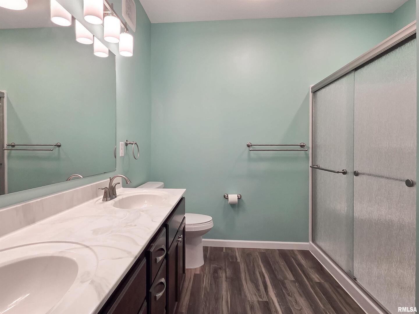 2592 Middle Road, Unit 313 Bettendorf, IA 52722 - Photo 36 of 52 a bathroom with a sink a toilet and shower