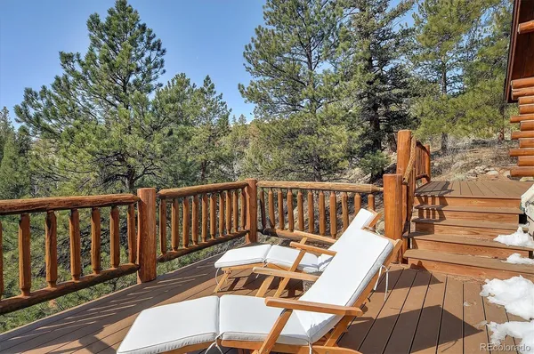 a view of balcony with wooden floor and outdoor seating