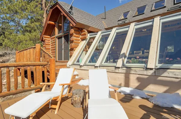 a view of balcony with furniture