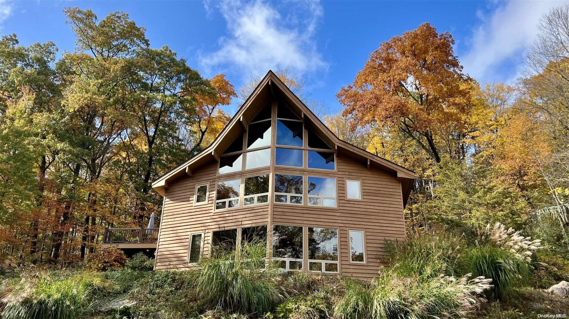 21 Pine Ridge Philipstown, NY 10524 - Photo 1 of 1 a front view of a house with a yard