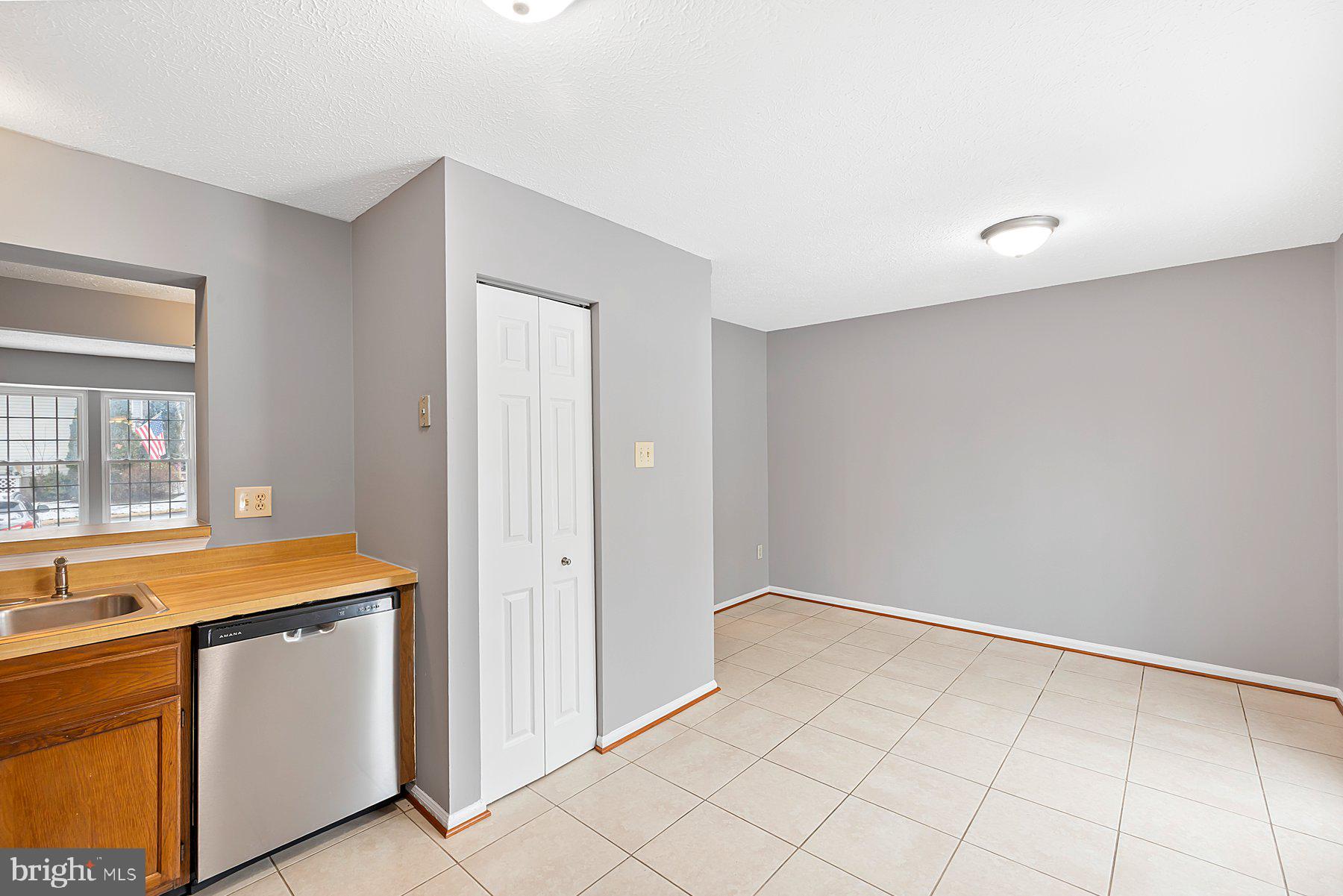 6795 Snow Goose Court Frederick, MD 21703 - Photo 12 of 36 a room with white cabinets and a sink