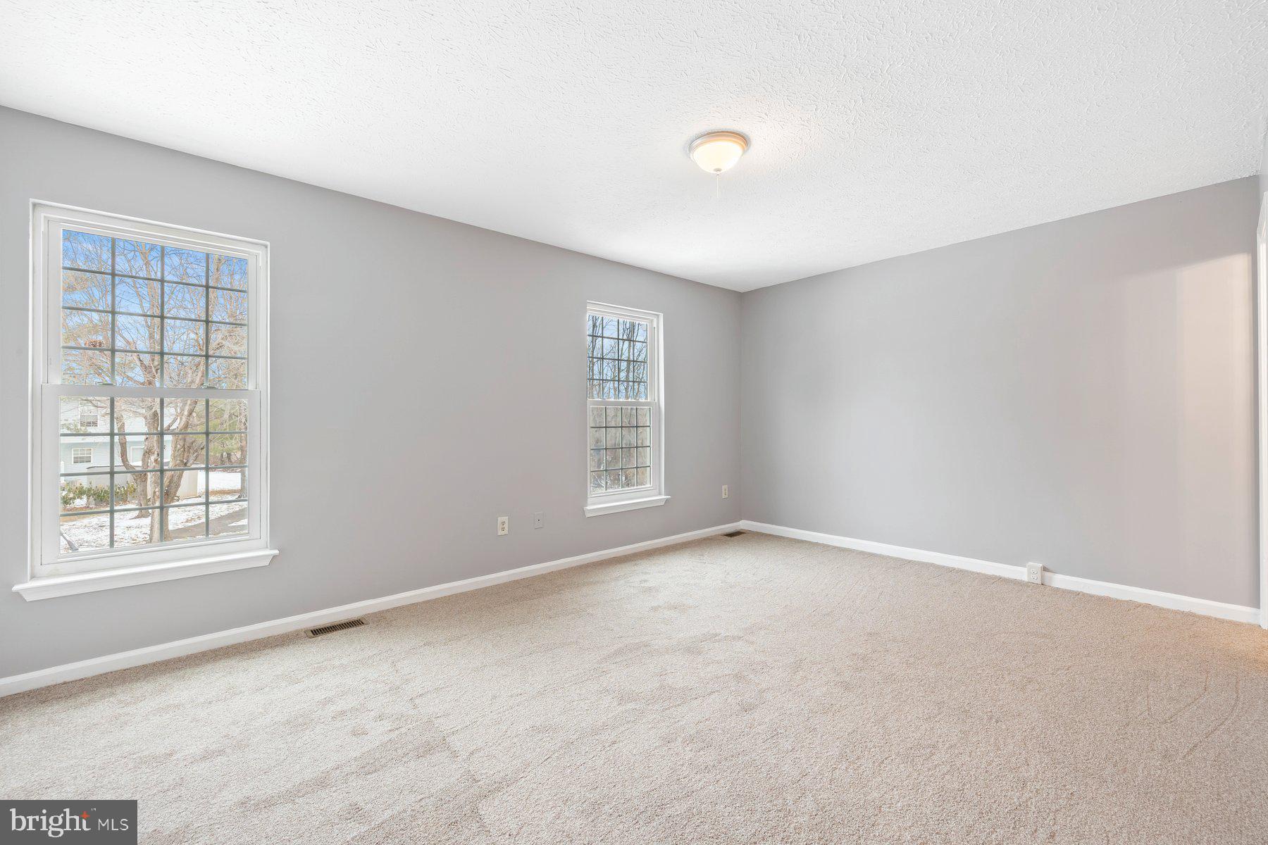 6795 Snow Goose Court Frederick, MD 21703 - Photo 17 of 36 an empty room with windows