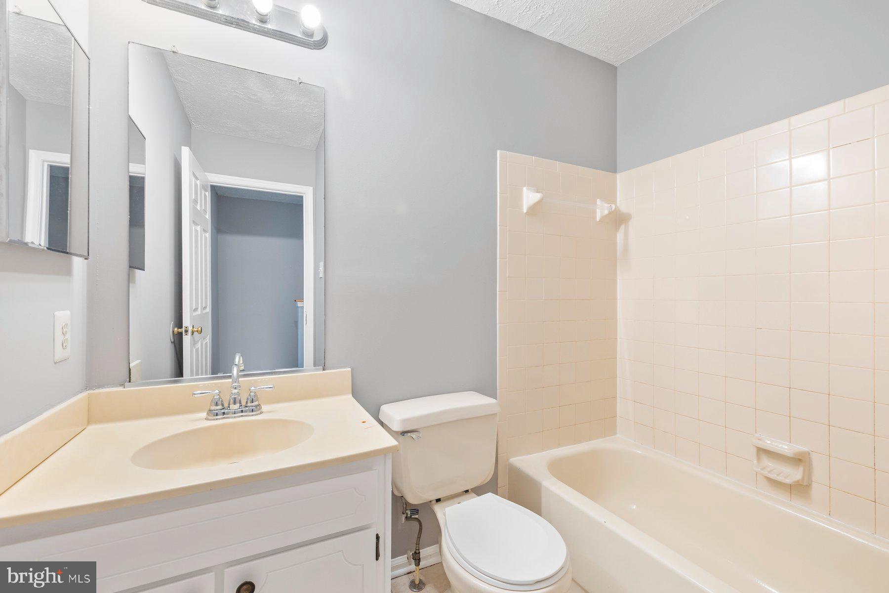 6795 Snow Goose Court Frederick, MD 21703 - Photo 18 of 36 a bathroom with a sink toilet and shower