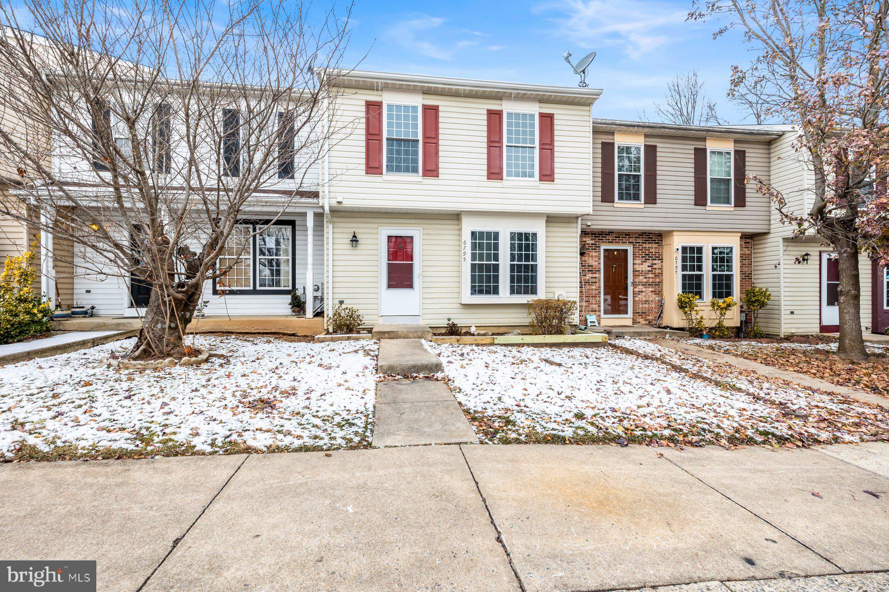 6795 Snow Goose Court Frederick, MD 21703 - Photo 2 of 36 a front view of a house with a yard