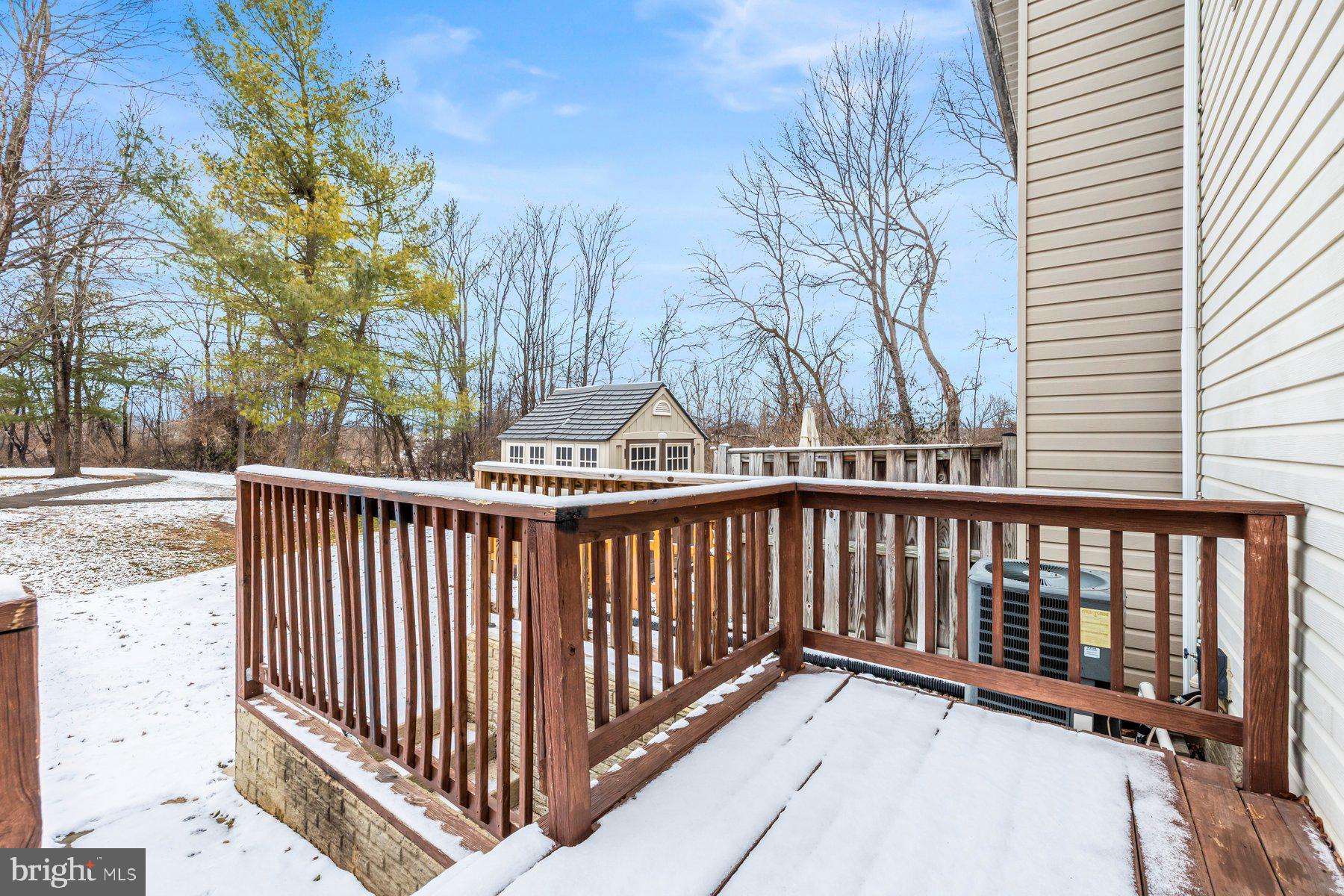 6795 Snow Goose Court Frederick, MD 21703 - Photo 29 of 36 a view of a balcony with wooden fence