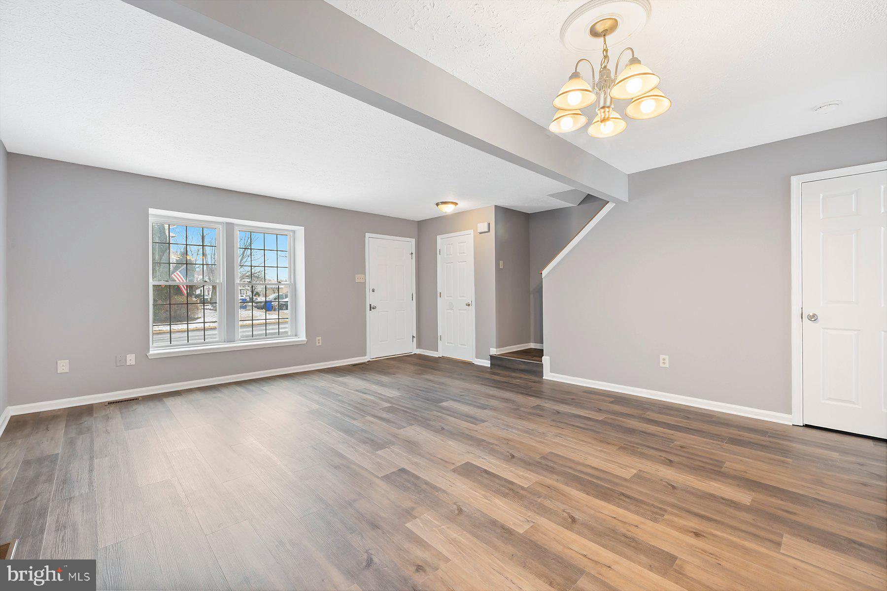 6795 Snow Goose Court Frederick, MD 21703 - Photo 3 of 36 an empty room with wooden floor and window