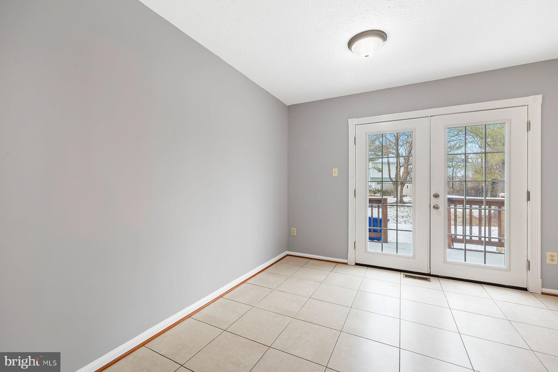 6795 Snow Goose Court Frederick, MD 21703 - Photo 9 of 36 a view of an empty room with a window