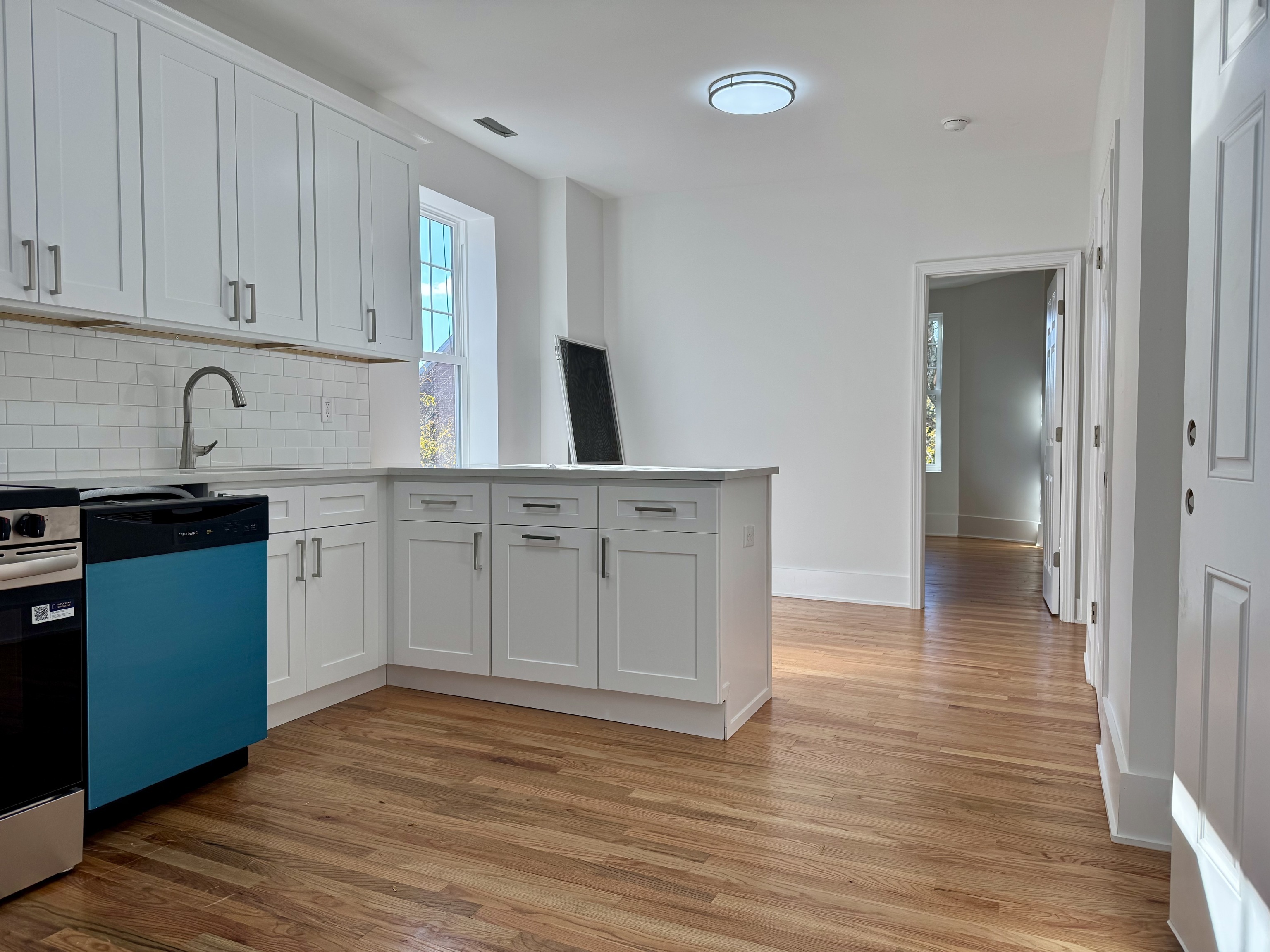 177 Chestnut Street, Unit 1L New Haven, CT 06511 - Photo 3 of 12 a kitchen with a sink cabinets and wooden floor
