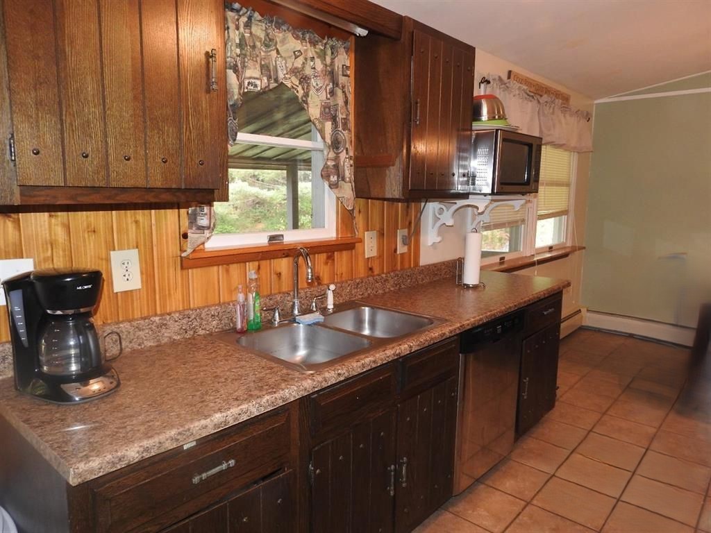 725 State Street Oneonta, NY 13820 - Photo 15 of 25 Galley kitchen has plenty of counter and cabinets