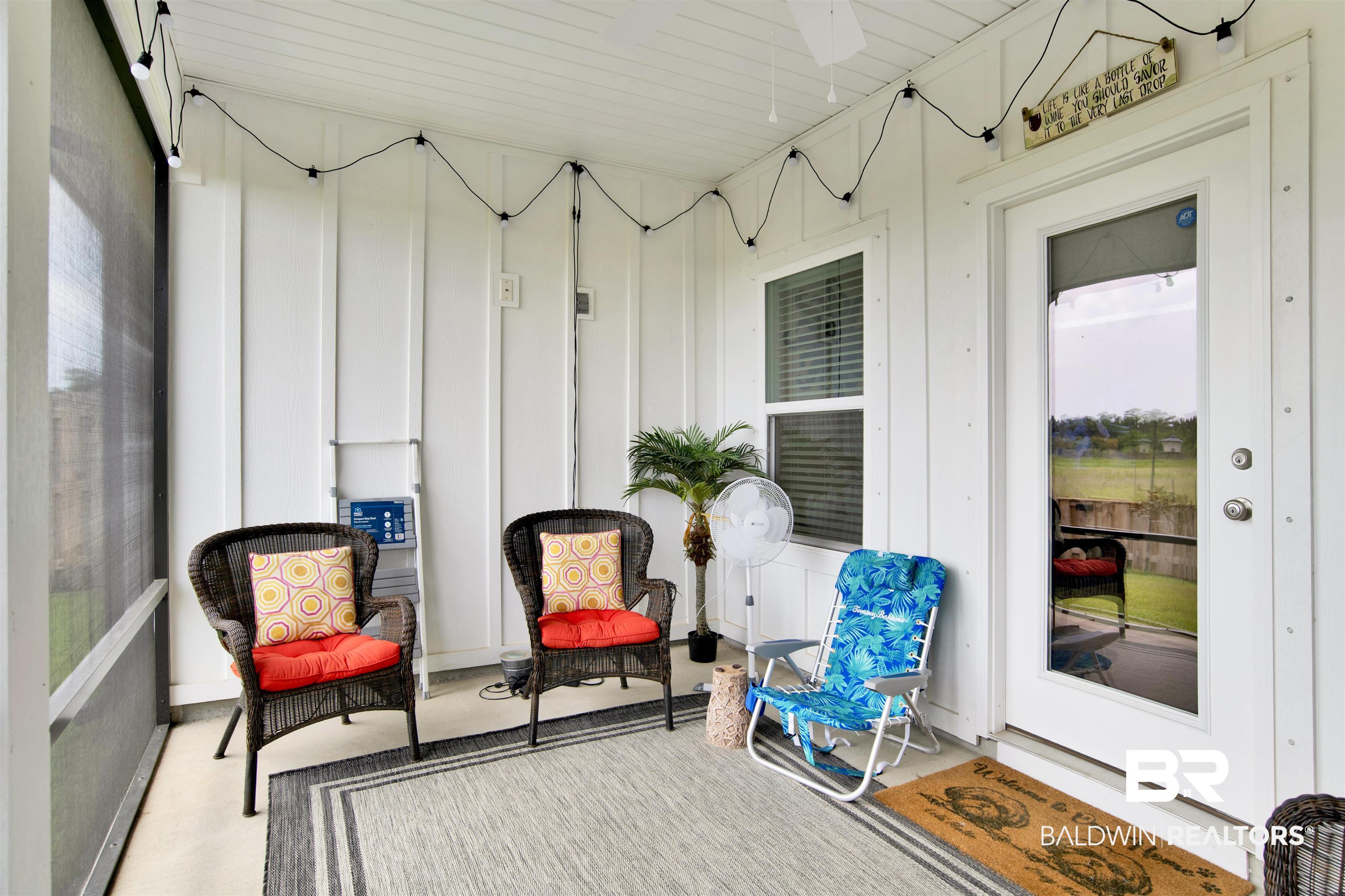 9894 Weller Cove Foley, AL 36535 - Photo 19 of 23 Sunroom featuring ceiling fan and plenty of natural light