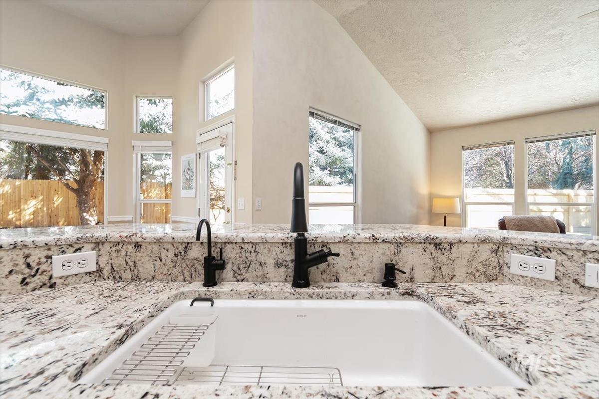 2495 East Ashbrook Court Eagle, ID 83616 - Photo 13 of 42 Recently installed Hans Grohe sink faucet and hot water on demand system.