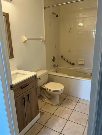 a bathroom with a toilet a sink and bathtub