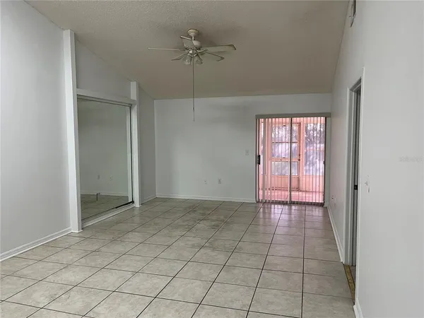 an empty room with fan