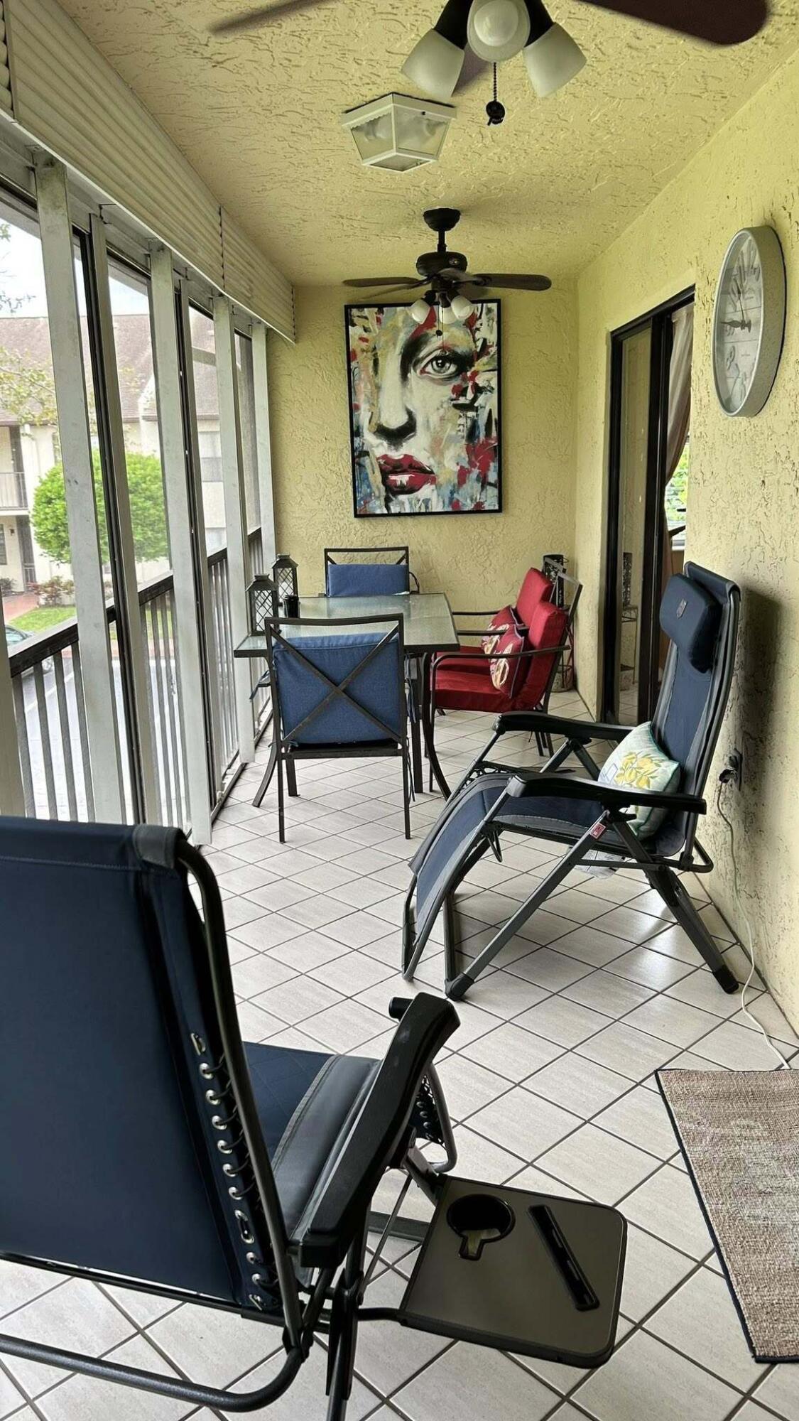 7855 Willow Spring Drive, Unit 726 Lake Worth, FL 33467 - Photo 3 of 16 a living room with furniture and a flat screen tv